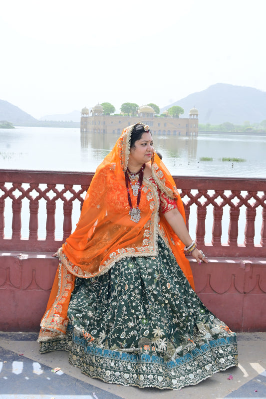 Green Lehenga with Orange Odhani & Heritage Embroidery